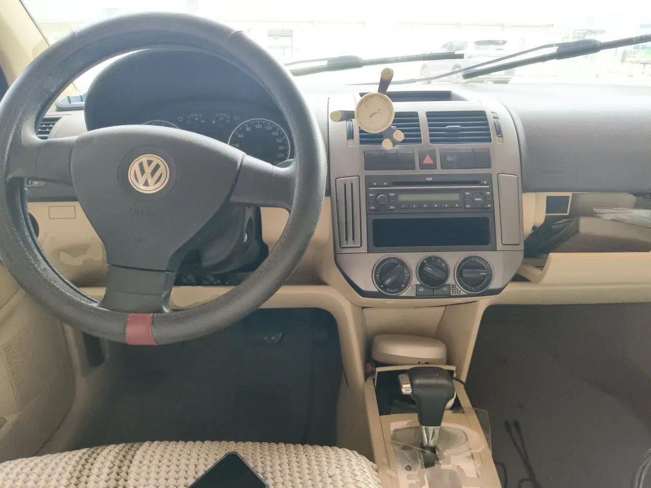 Volkswagen Polo 2009 Jingqu 1.4L Automatic Elegant Edition — миниатюра 9