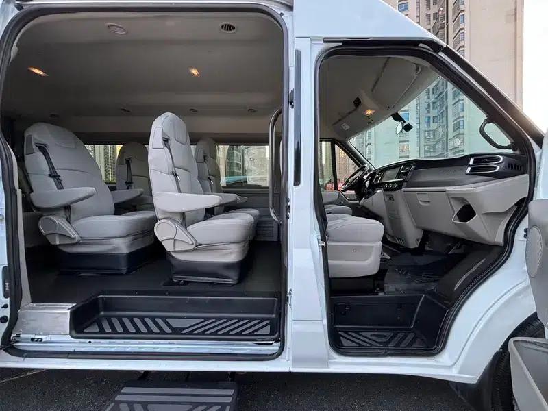 The new generation Ford Transit 2021 Pro 2.2T automatic luxury bus with long wheelbase, mechanical steps, 9 seats, and a mid-roof. — миниатюра 11