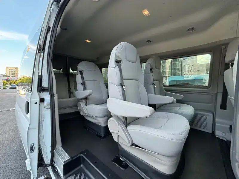 The new generation Ford Transit 2021 Pro 2.2T automatic luxury bus with long wheelbase, mechanical steps, 9 seats, and a mid-roof. — миниатюра 15