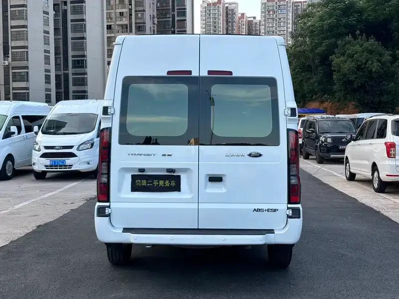 The new generation Ford Transit 2021 Pro 2.2T automatic luxury bus with long wheelbase, mechanical steps, 9 seats, and a mid-roof. — миниатюра 4