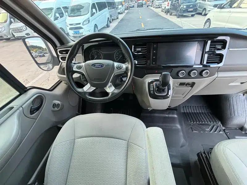 The new generation Ford Transit 2021 Pro 2.2T automatic luxury bus with long wheelbase, mechanical steps, 9 seats, and a mid-roof. — миниатюра 9